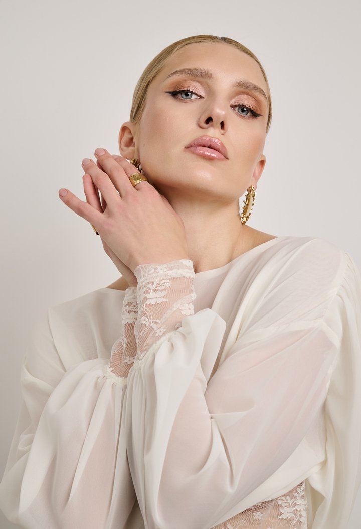 Lace blouse with a sheer back