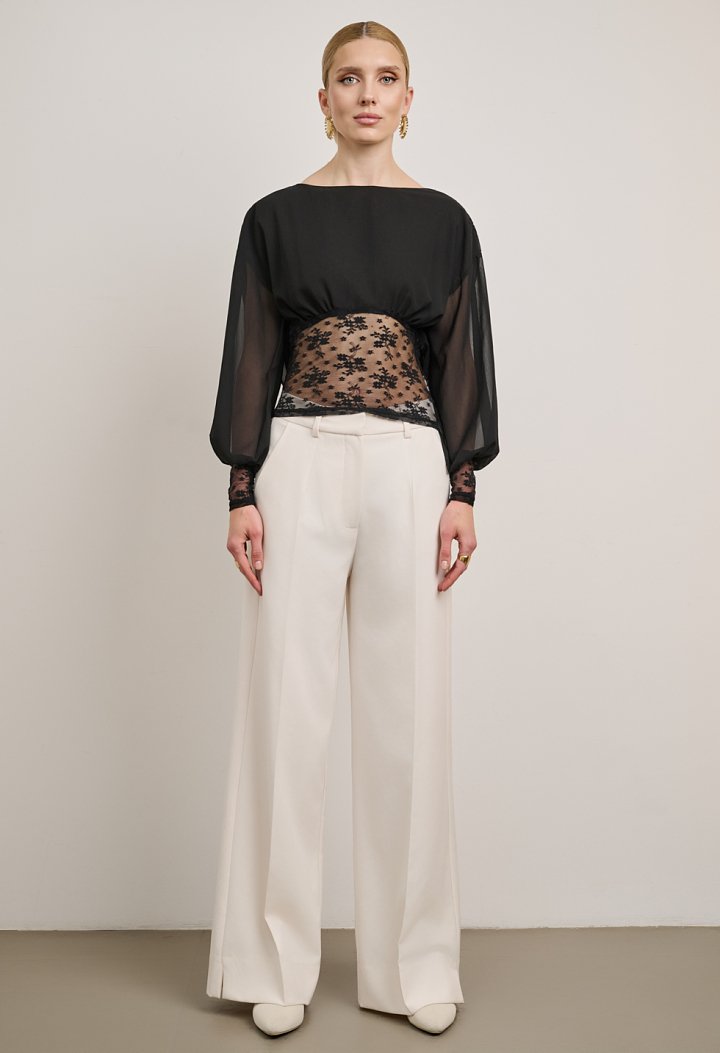 Lace blouse with a sheer back