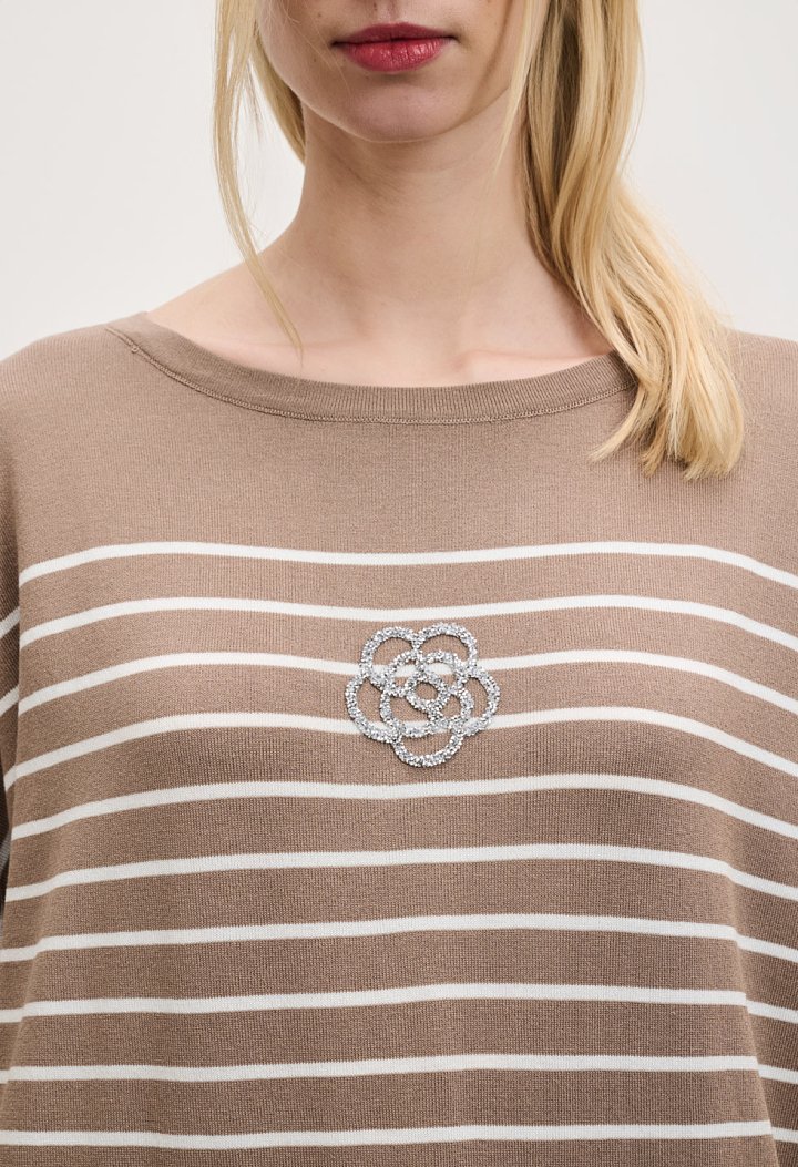 Striped blouse with a rhinestone flower design