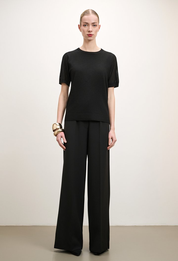Knit top with sheer sleeves